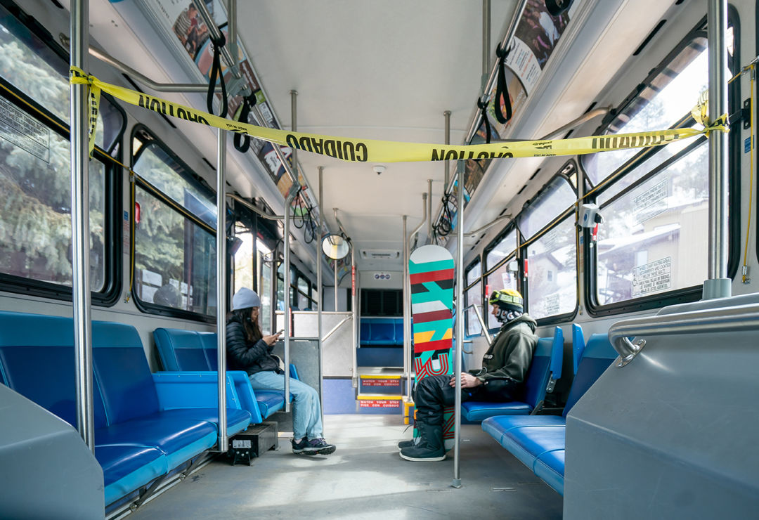 Two passengers ride the public bus in the Town of Vail