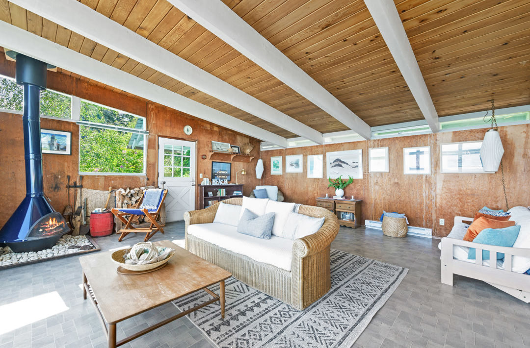 Property Watch: A Tiny Waterfront Cabin with a Bananas View 3 living room 9 m7vy4y