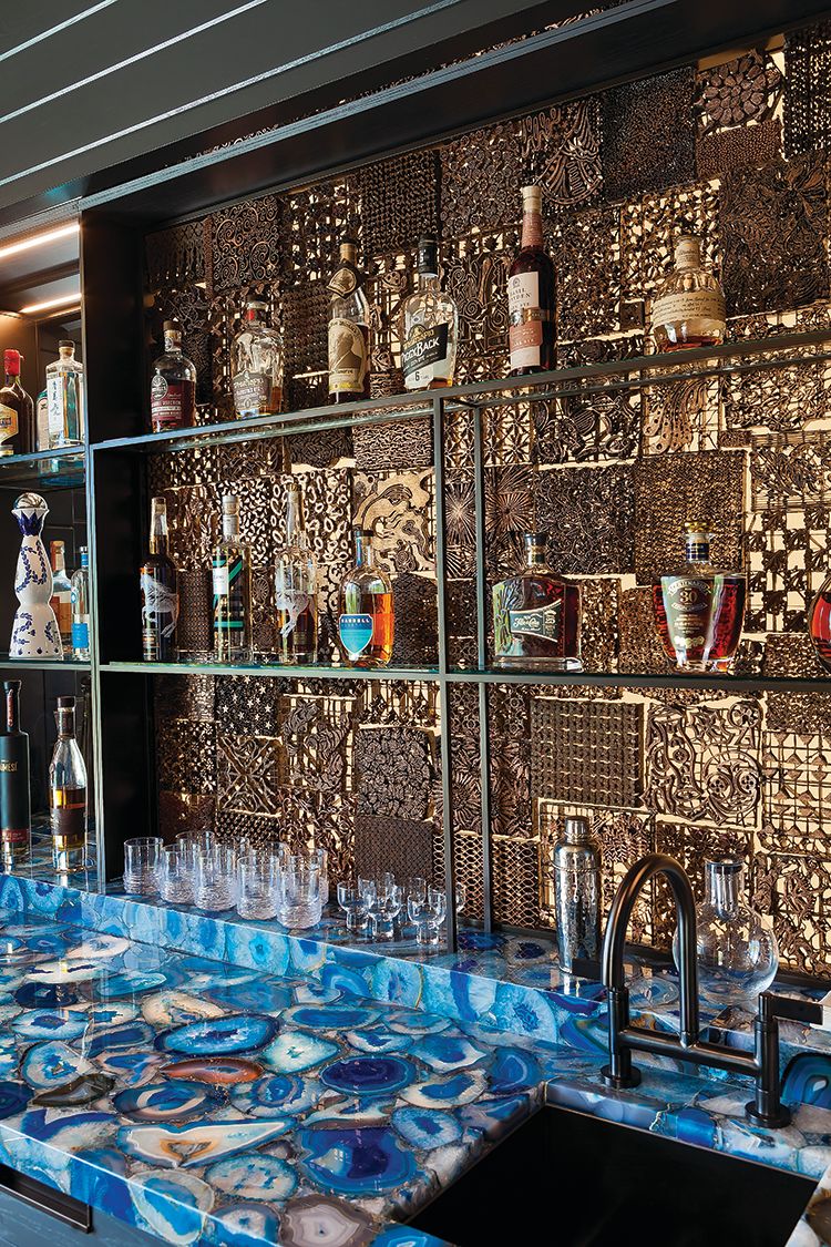 A bar wall is decorated with Balinese print stamps.