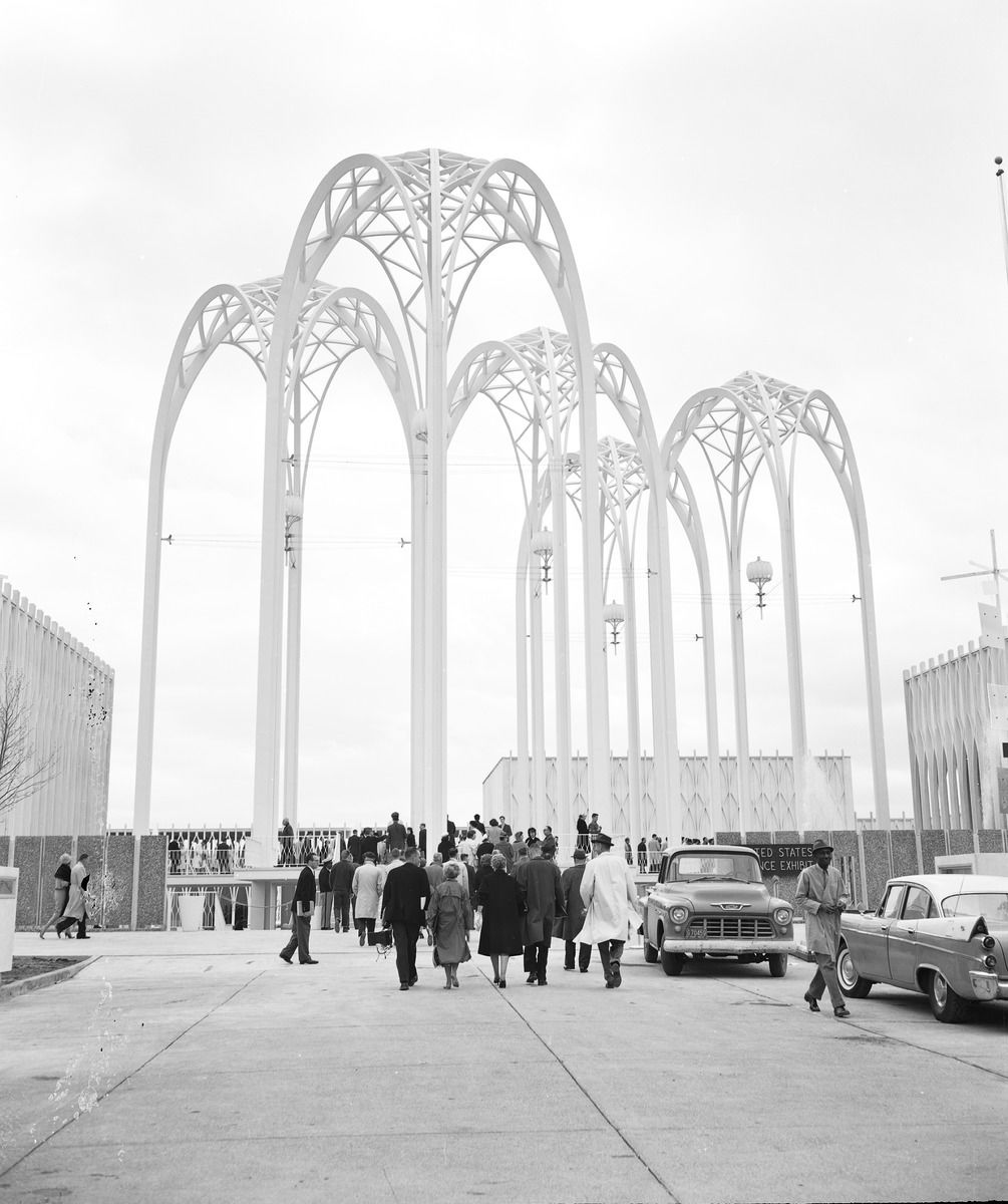 The three white arches at Pacific Science Center in a historical photo.