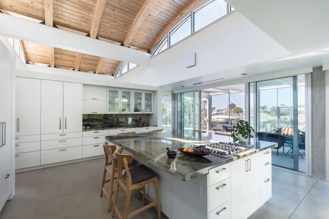 The living, dining and kitchen spaces flow into each other.