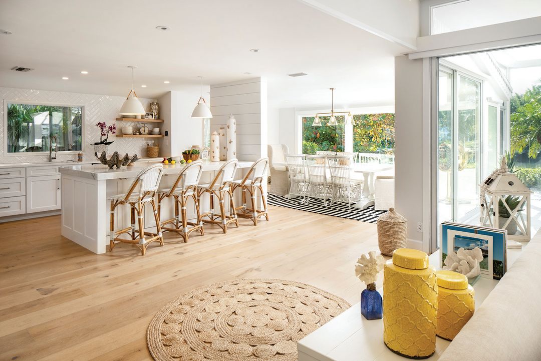 A partial wall anchors the kitchen island while maintaining an open floor plan.