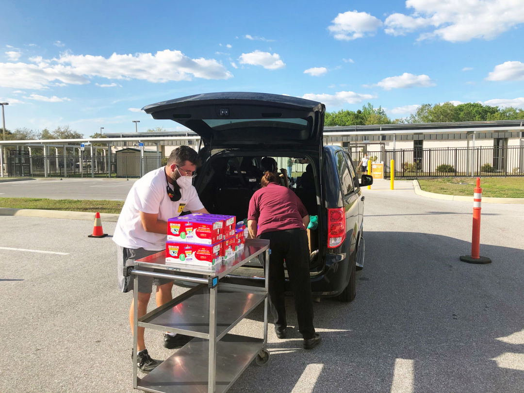 Volunteers from All Faiths Food Bank helped to distribute meals in advance of spring break; this distribution was held at Fruitville Elementary School