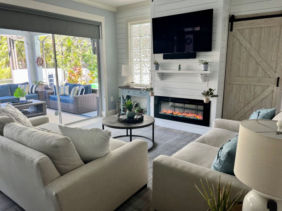 A living room with a fireplace.