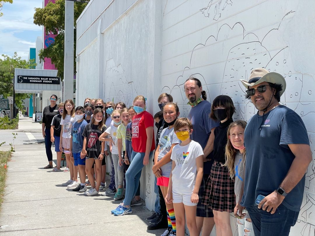 DreamLarge founder Anand Pallegar with students and faculty from Sarasota School of Arts and Sciences.