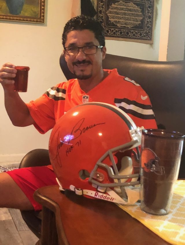 Fahd Farissi enjoying a beer in football attire.