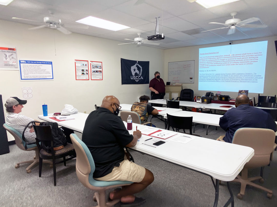 Community members currently participating in a security guard training class taught by Don Burrow (background, standing) include, from left to right, Jonathon Kikly, Sophia Wallace, Tyrone Cowan and Edmund Wilborn.