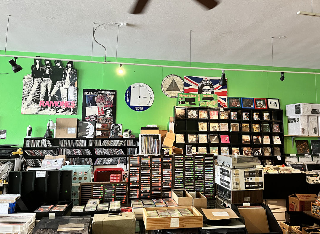 A record store with lime green walls.
