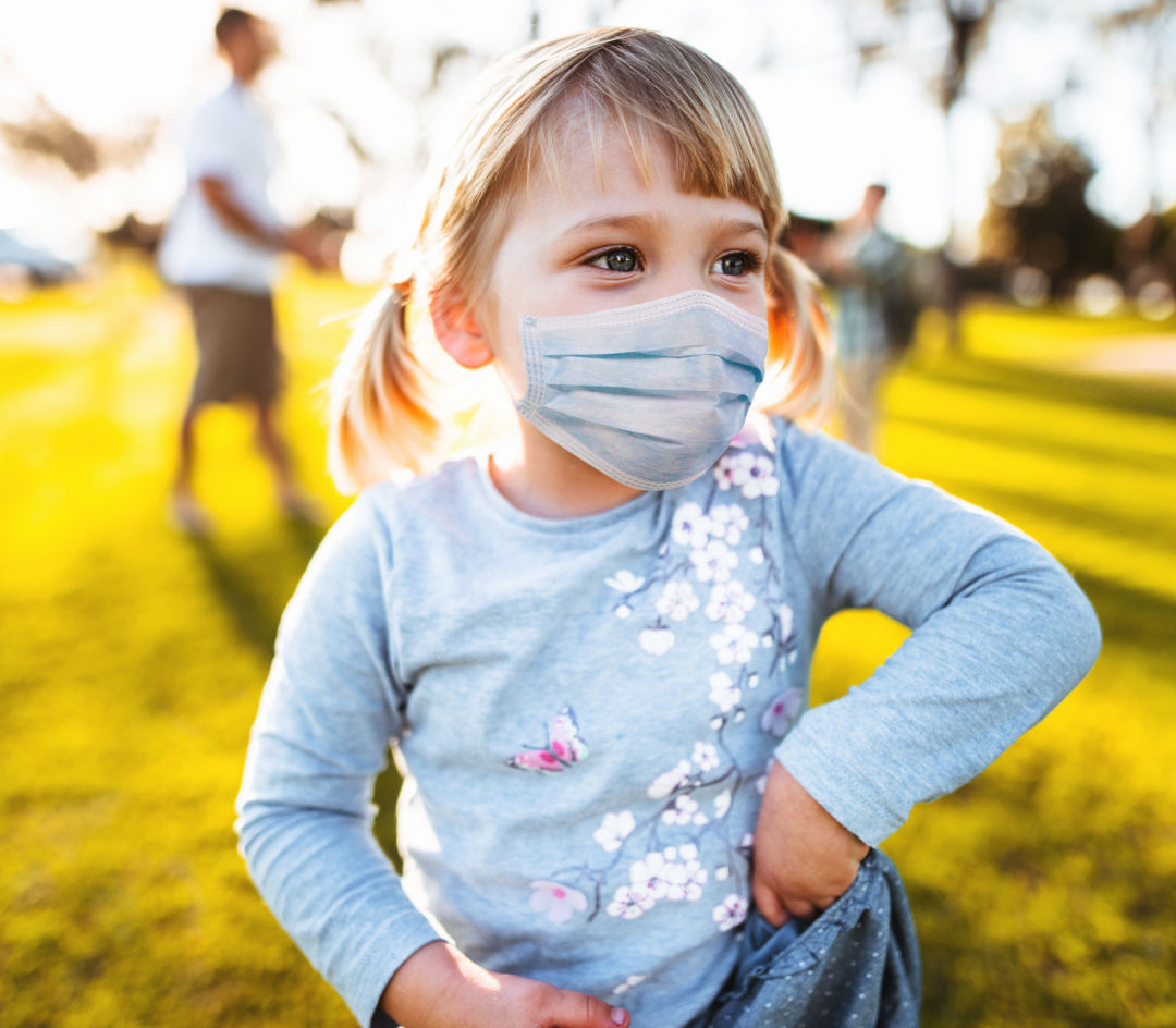 Child wearing a protective mask