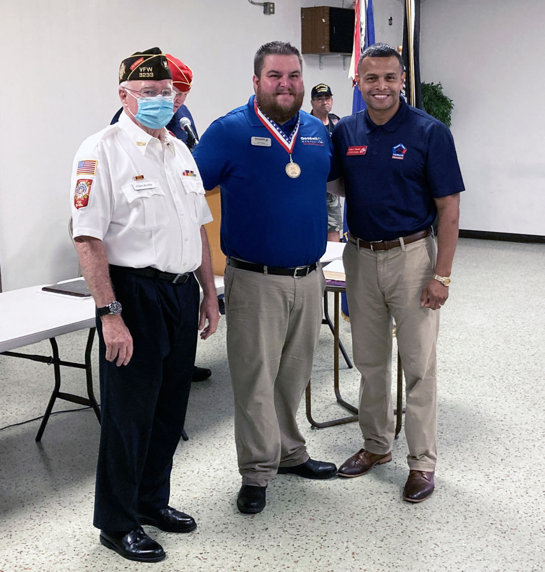 John H. McLain Veteran of the Year Award-winner Todd Hughes (center) with Christopher Kielty (left) and Carlos Moreira of the Sarasota County Veterans Commission