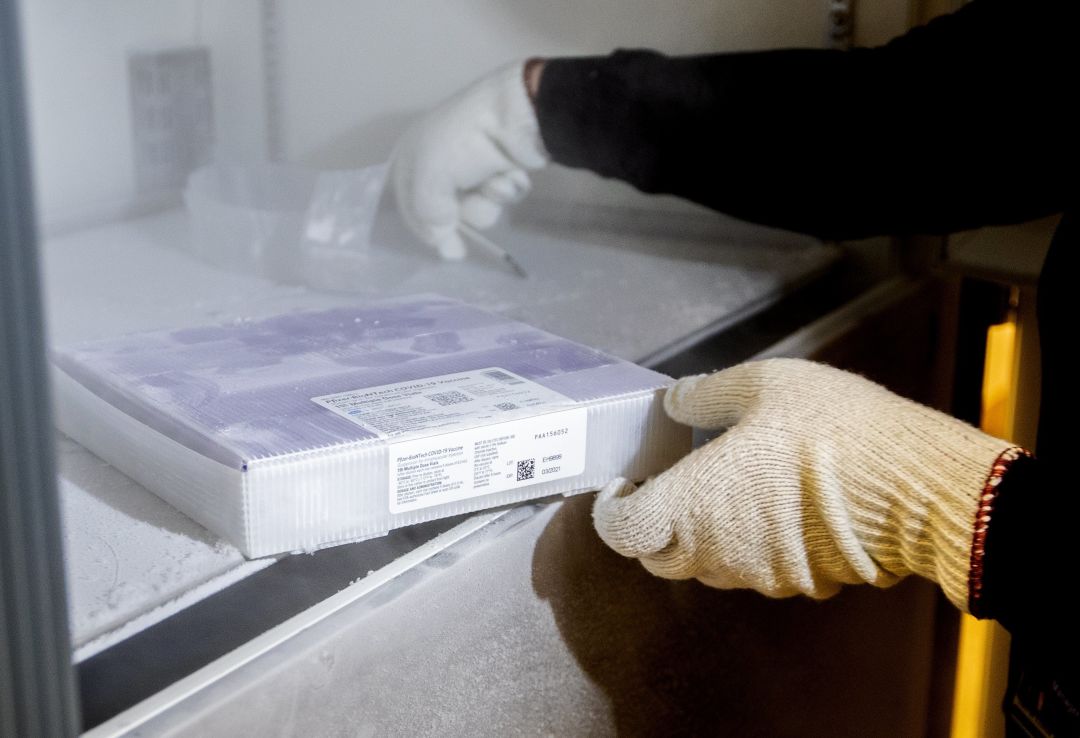 Pfizer and BioNTech vaccine package in refrigeration.