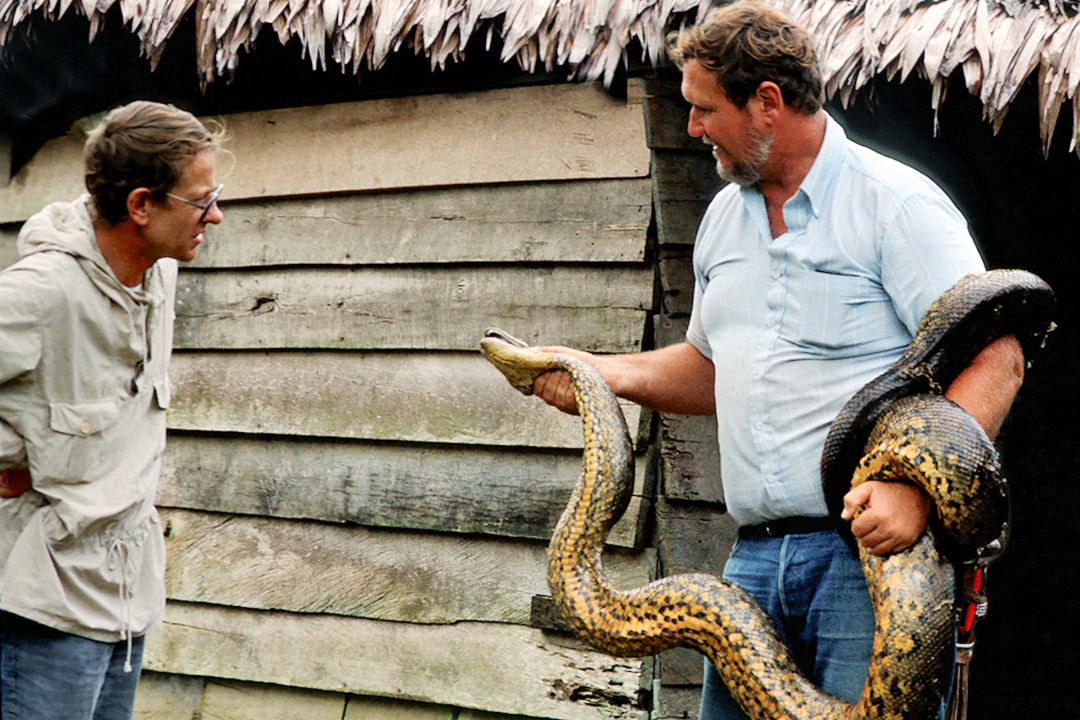 Cathcart holding an anaconda.