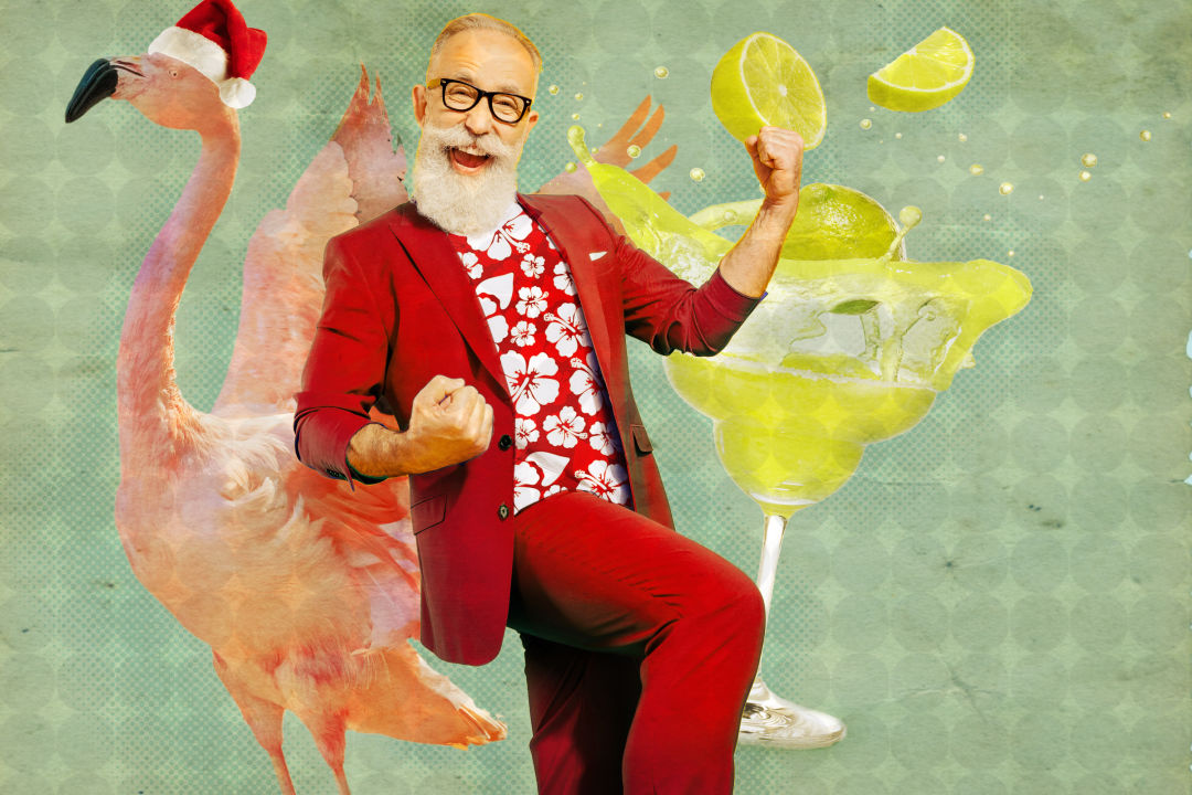 Seaside Santa enjoys a margarita with his magical flying flamingo.