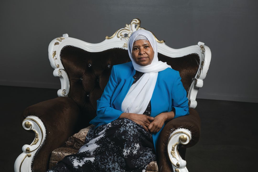 Sahra Farah sits in a large chair.