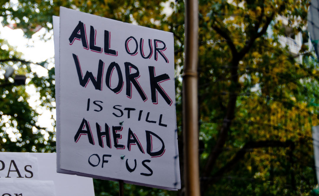 All Our Work Is Still Ahead of Us sign at Seattle protest after Joe Biden's election