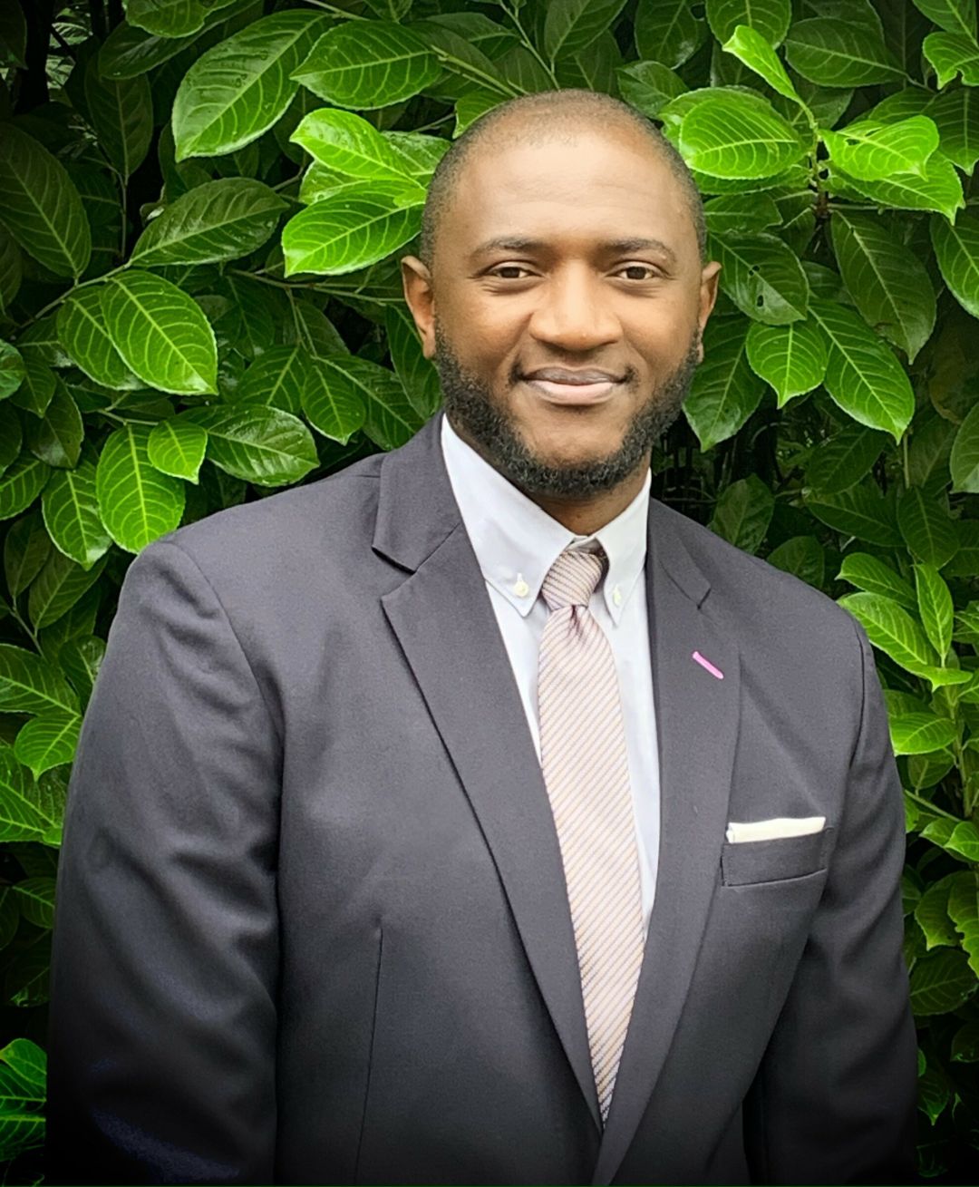 Solomon Alabi in a suit.