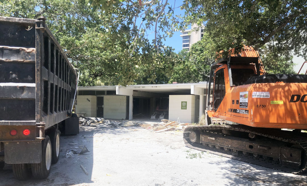 Demolition in progress child Protection Center's storage unit at 750 S. Orange Ave. in downtown Sarasota, which was deemed hazardous and was preventing the organization from expanding.