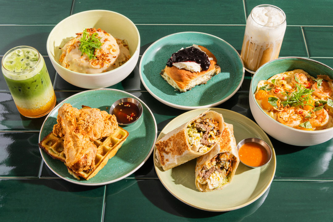 Fried chicken on pandan waffles, black sesame cinnamon rolls, and fish sauce bacon breakfast burritos at Memoire Ca Phe.