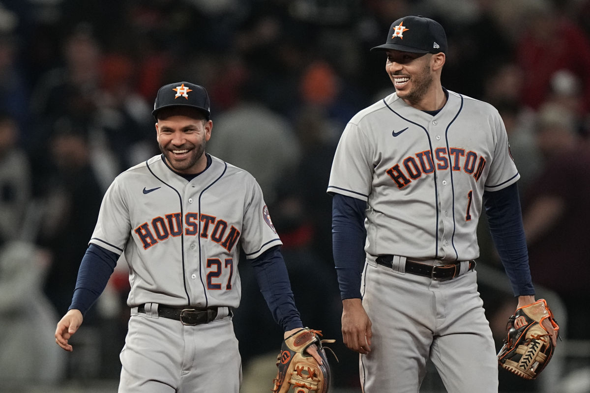 Houston Astros' Kyle Tucker is safe at second on a fielding error by  Atlanta Braves second baseman Ozzie Albies during the sixth inning in Game  2 of baseball's World Series between the