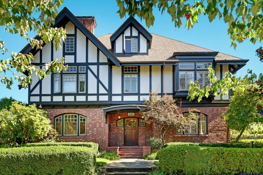 A mansion with brick on the first floor and half-timbering above,