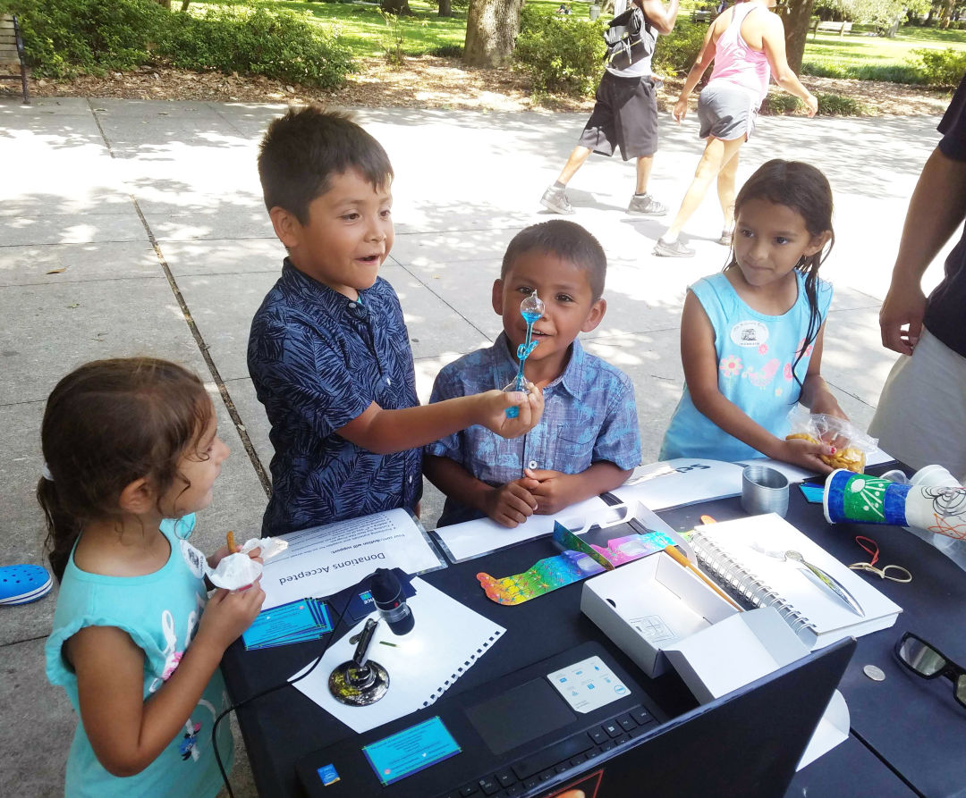 Local kids take part in a Sidewalk Science Center experiment.