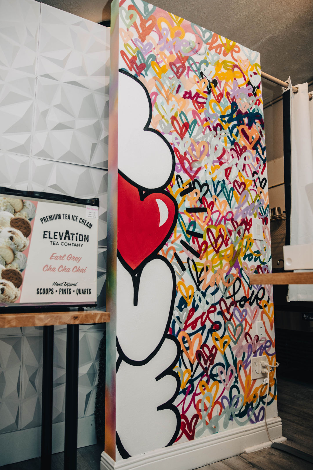 Love mural with hearts by Sarasota artist Brandon Thrift at Elevation Tea Company