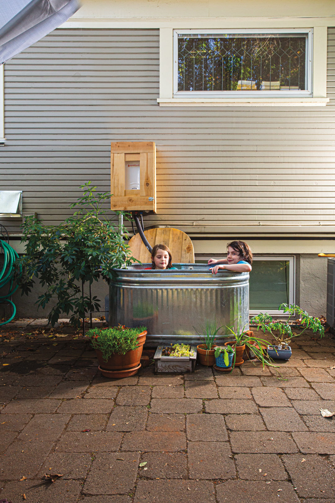 How We Made A Metal Stock Tank Into Our Bath Tub 