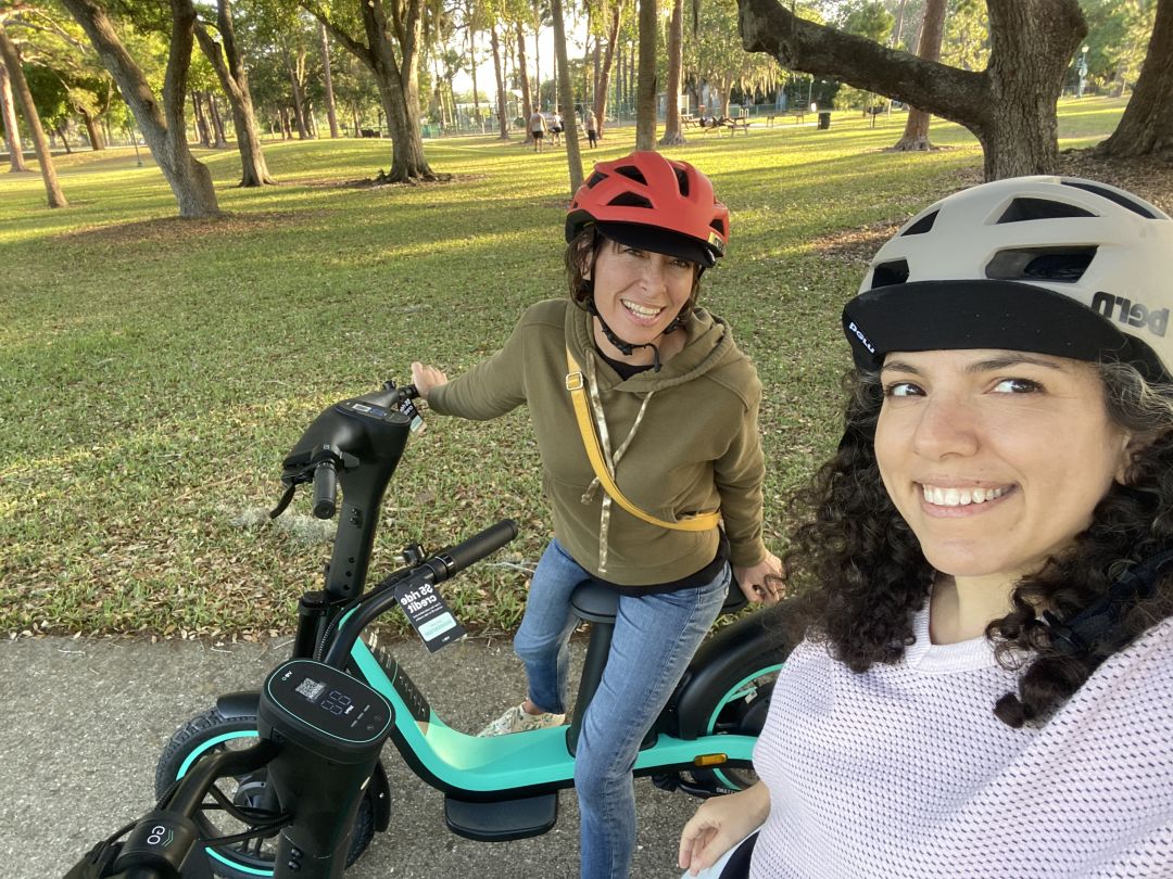 Two women taking a selfie on Veo seated scooter rentals in Sarasota