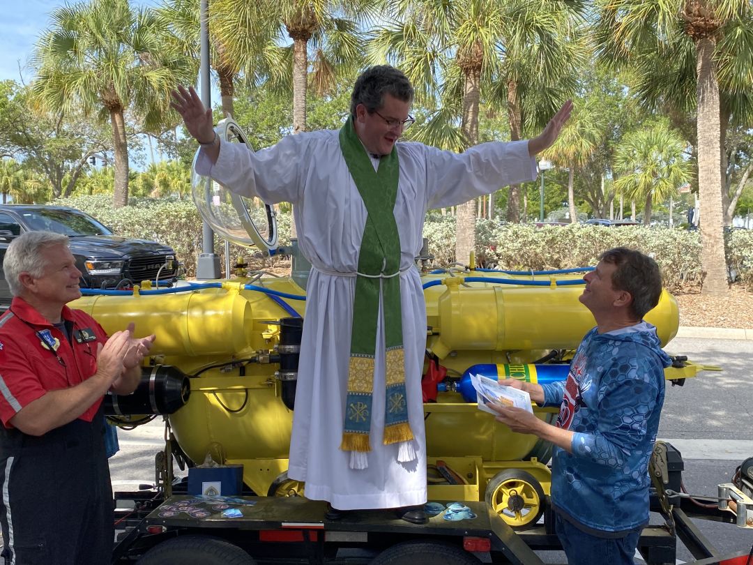 Scott Cassell, Father Wilson, Scott Gonnello and Great White, the yellow submarine outside of the Church of the Redeemer in Sarasota.