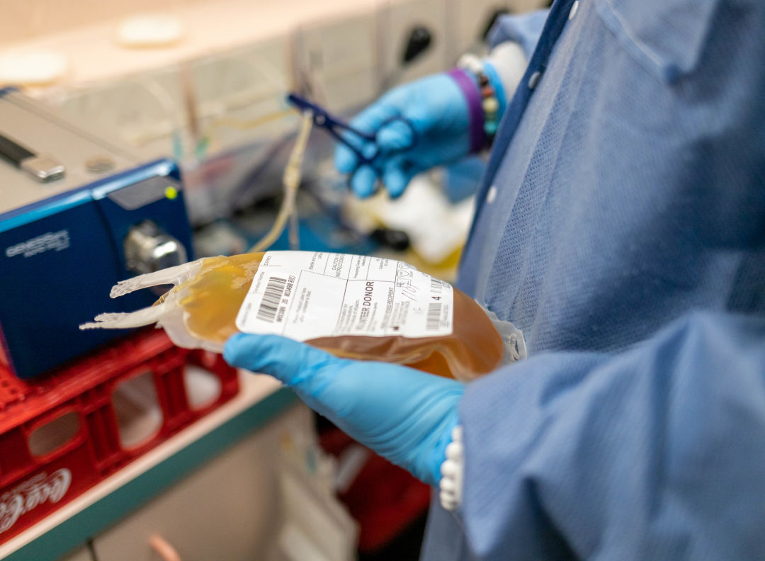 A SunCoast Blood Centers staff member prepares a blood donation for shipment.