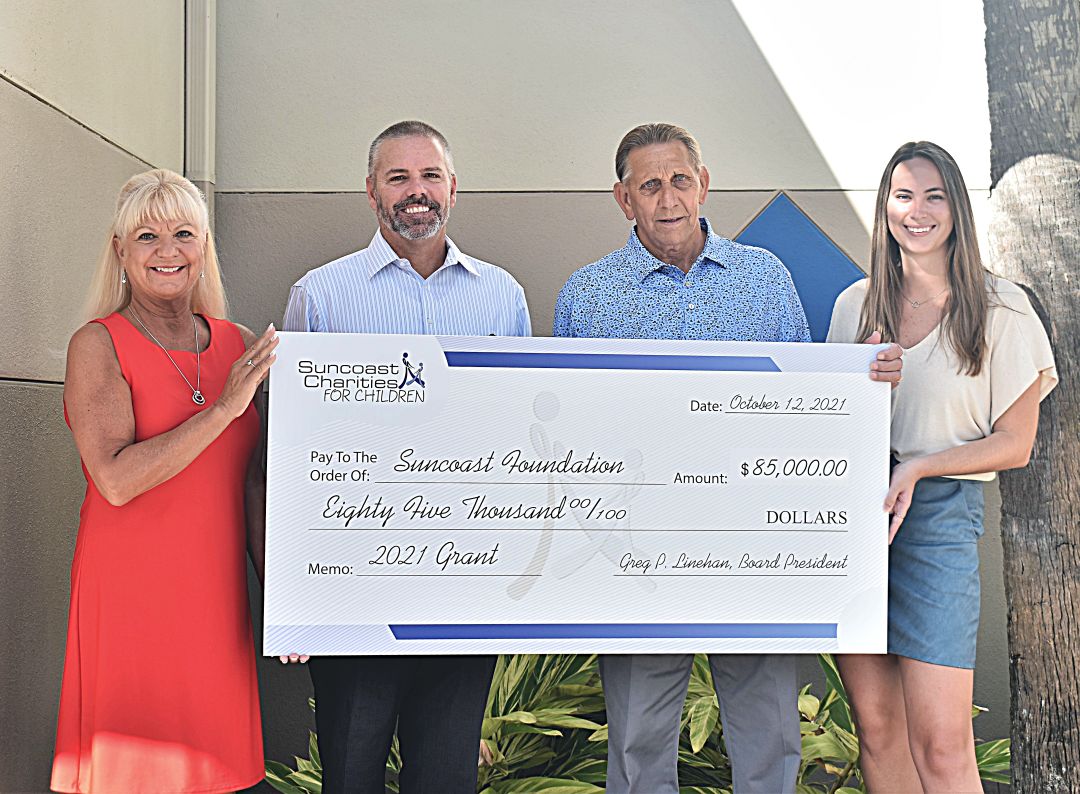 From left to right, Lucy Nicandri, executive director, Suncoast Charities for Children; Greg Linehan, board president, Suncoast Charities for Children; Robert Flanders, board president, Suncoast Foundation; and Lisa Baer, director of special events, Suncoast Charities for Children