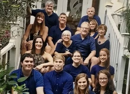 Carol Strange (center) with her family