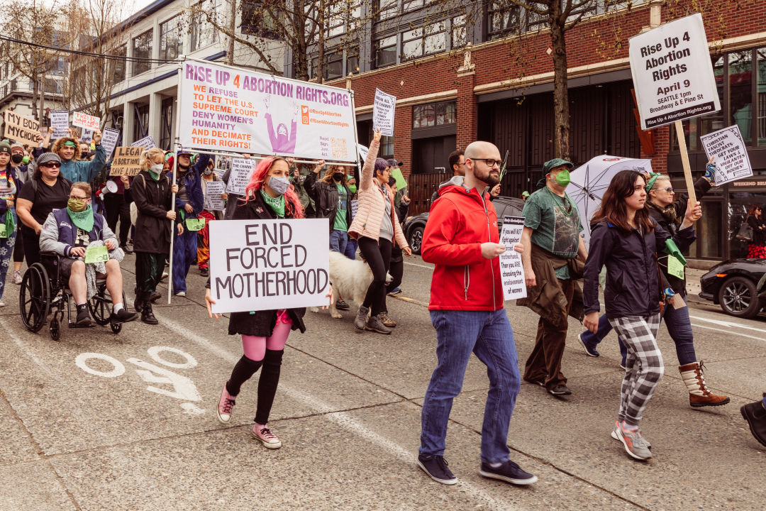 Abortion rights activists holding signs in a Seattle street