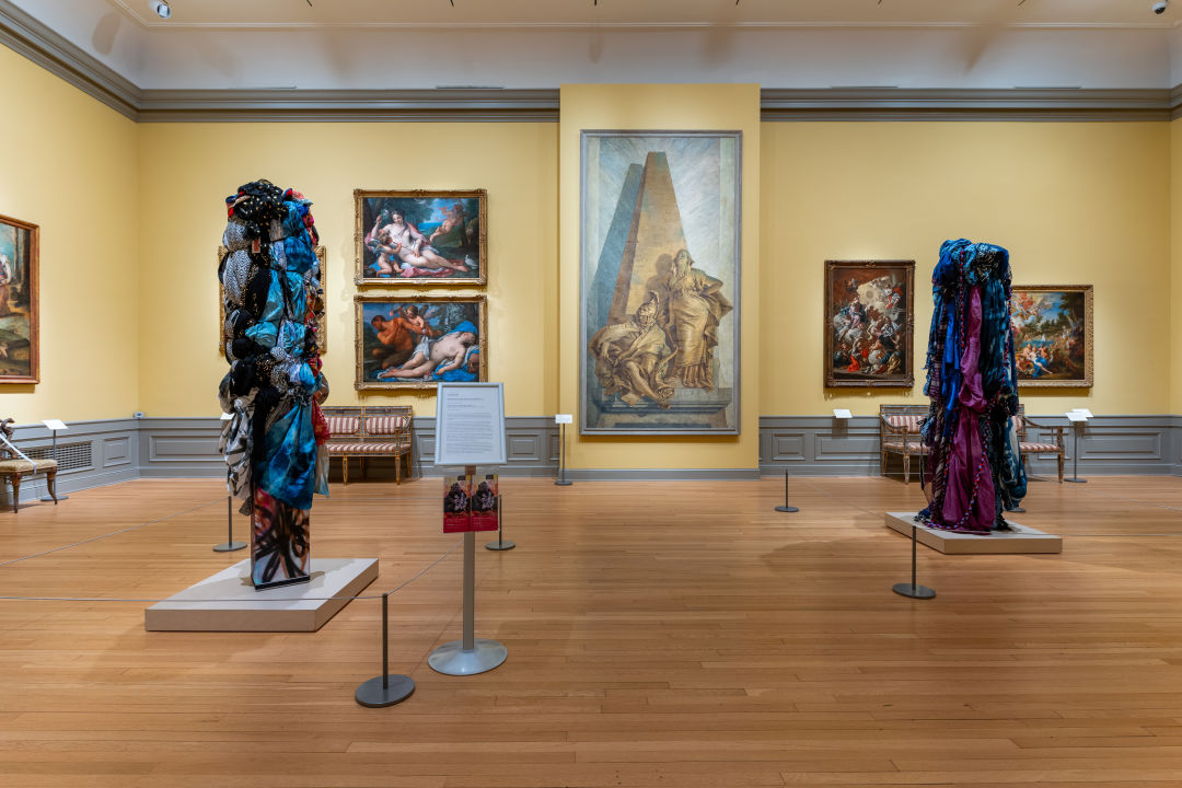 Bale Variant No. 0027 (Charm City Girl Stele) and Bale Variant No. 0028 (Blue Stele) are installed in Gallery 18 of The Ringling Museum of Art.