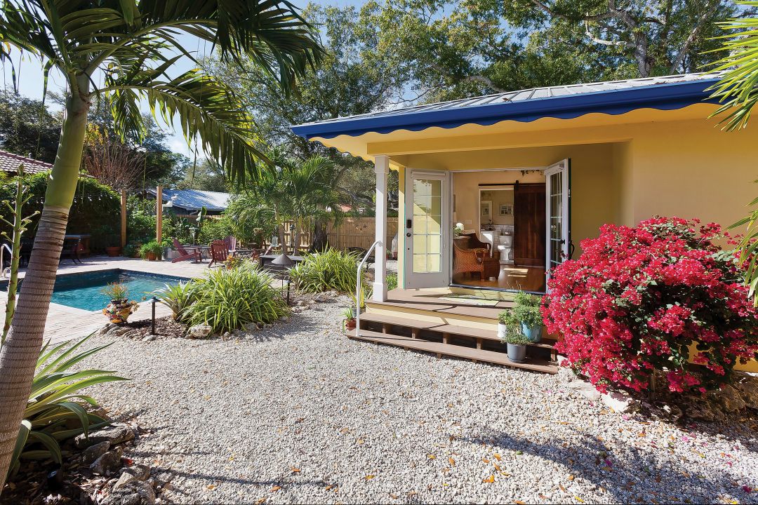 Adding a front porch extends the space and creates a sunny outdoor nook.