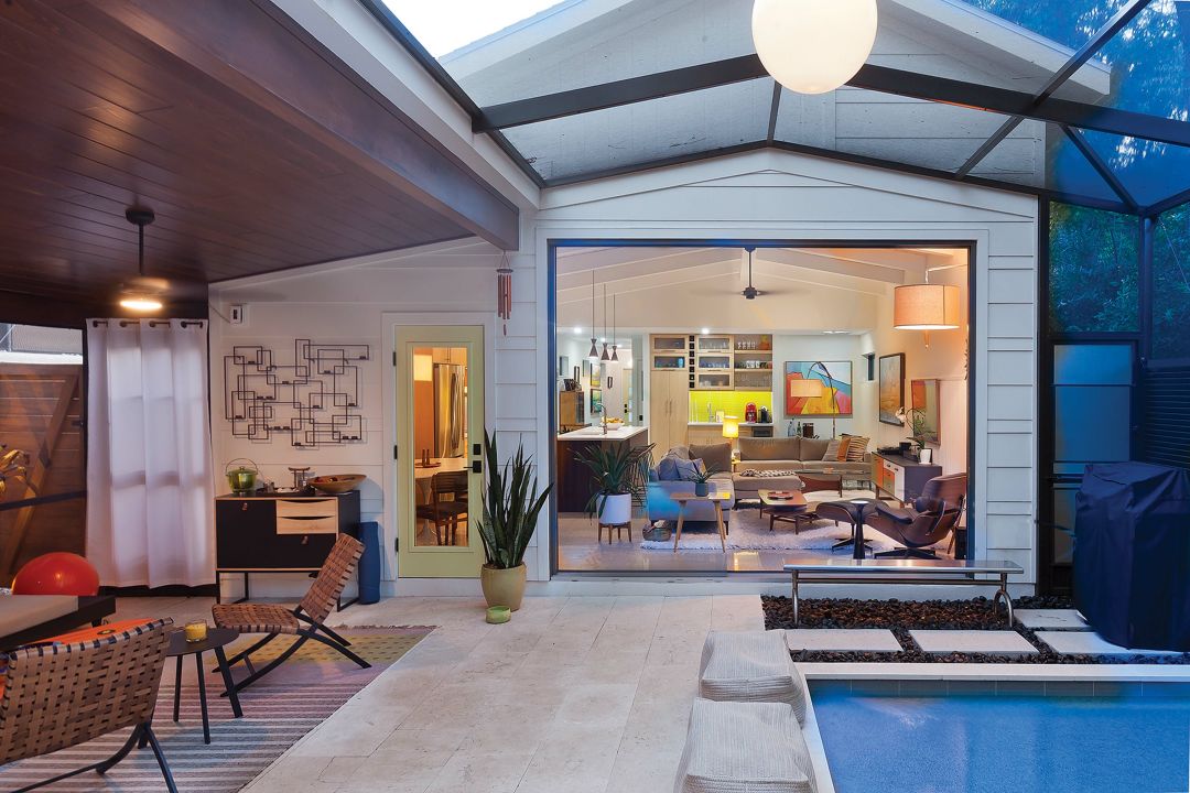 The cypress ceiling, black stones and lounge gear make the pool area feel like a spa-day getaway.