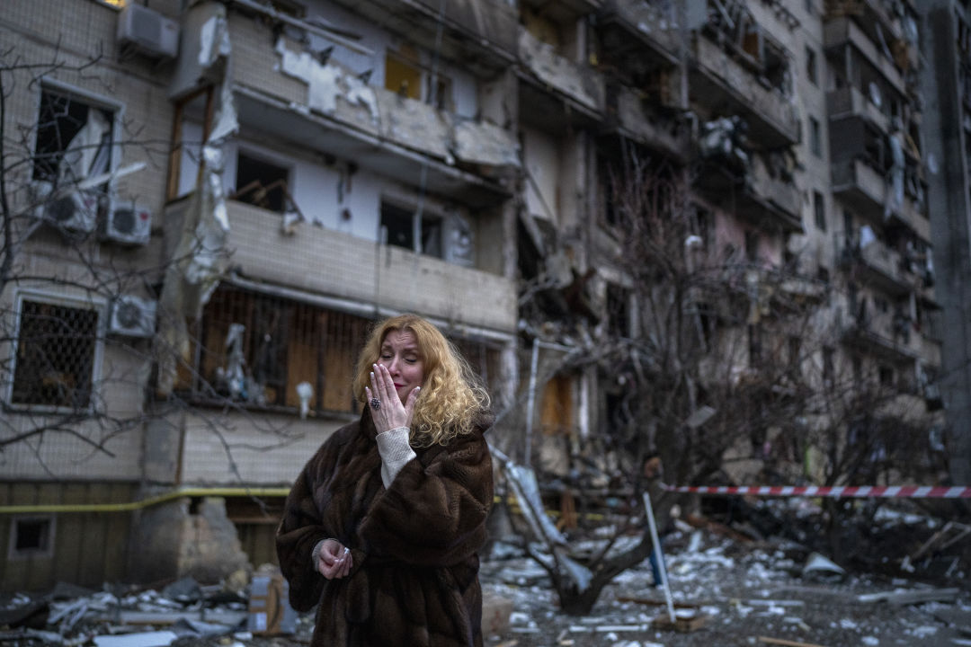 Woman devastated next to her house following a rocket attack the city of Kyiv, Ukraine.