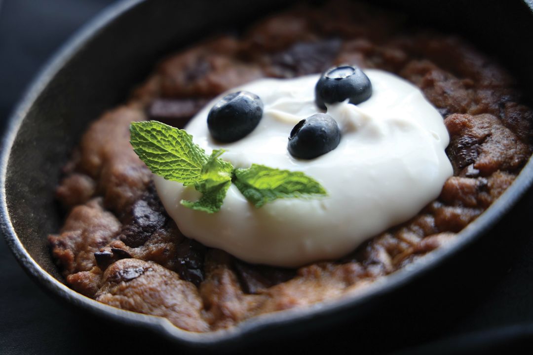 The warm cast iron cookie topped with a vegan "custard."