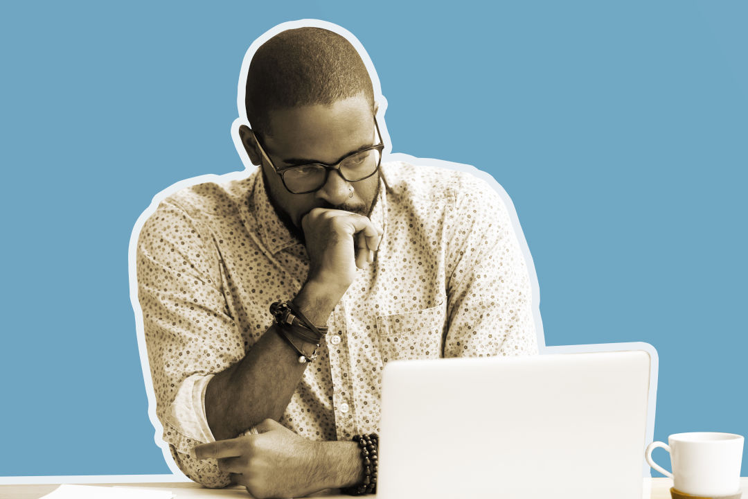 Man grimacing at computer