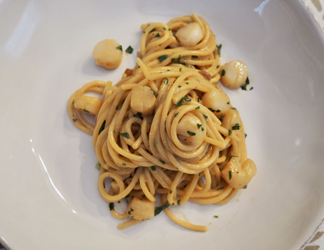 Bay scallops with lemon butter spaghetti.