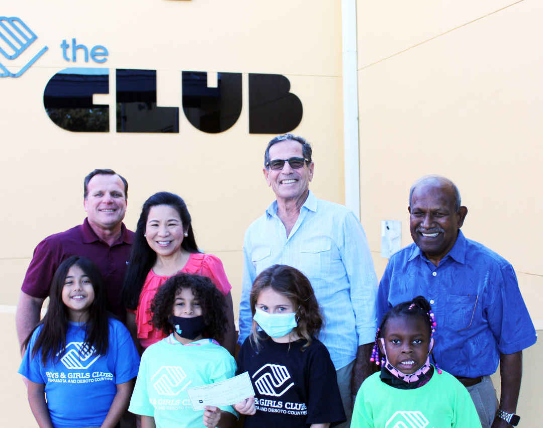 Boys & Girls Clubs of Sarasota and DeSoto Counties president/CEO Bill Sadlo, Rotary Club of Sarasota President Lee-En Chung and directors Lou Schwartz and Dr. Kumar Mahadevan with members of the Boys & Girls Clubs.