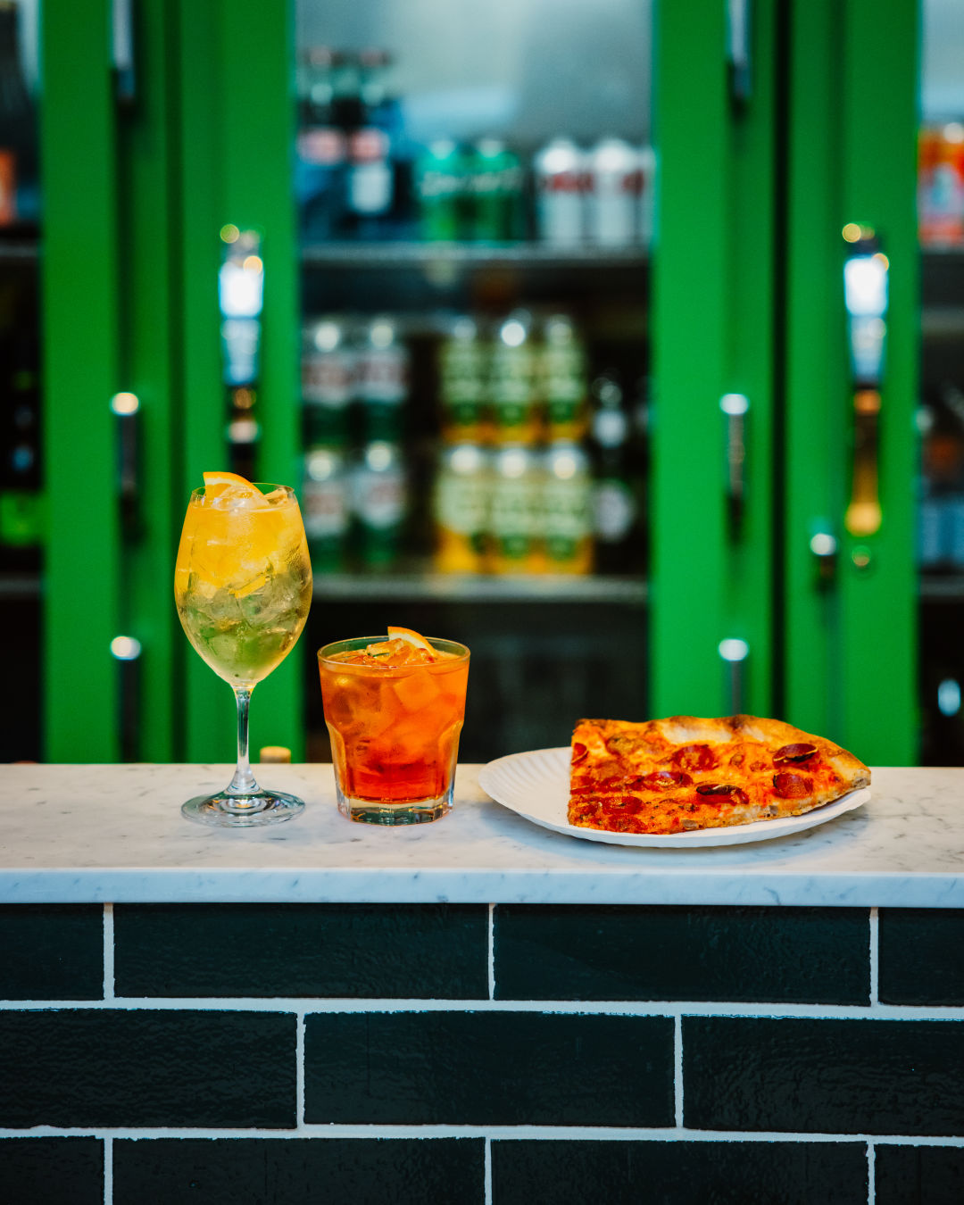 Best Restaurants and Bars Near Seattle's Lumen Field and T-Mobile Park 4 Un Po Tipsy negroni spritz and pizza 8461 er7d5m