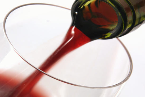 Wine being poured in a glass rnem0f