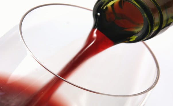 Wine being poured in a glass rnem0f
