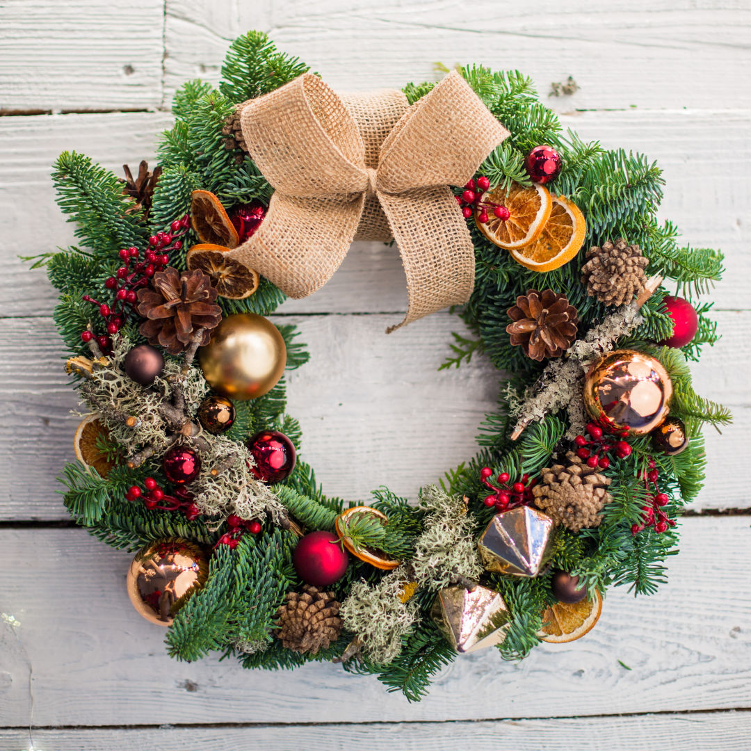 A christmas wreath with dried orange slices.