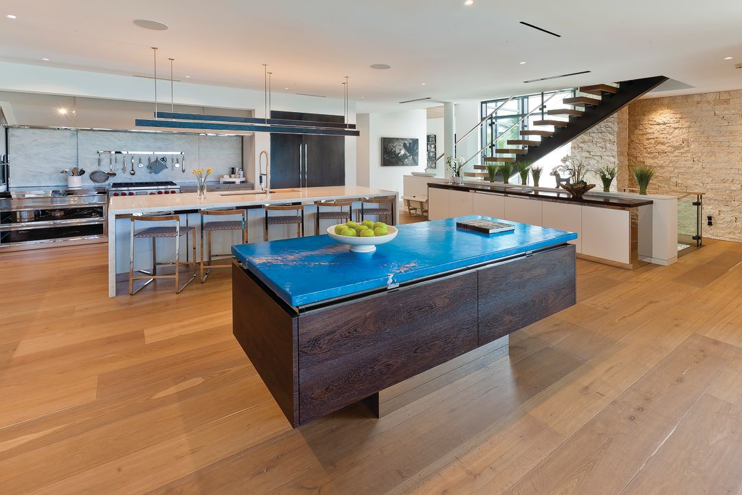 The kitchen's showpiece is the blue terracotta and limestone countertop shipped from Italy.