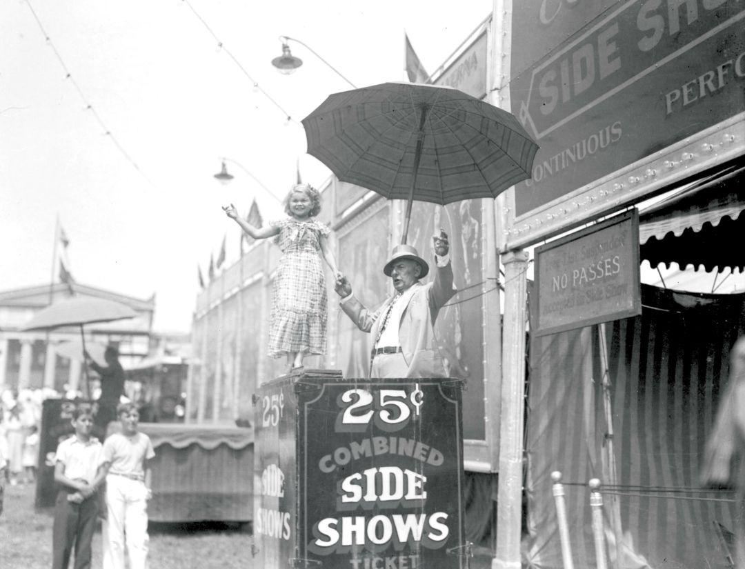 Sarasota’s Daisy Doll with sideshow manager Clyde Ingalls in front of the bally stage.