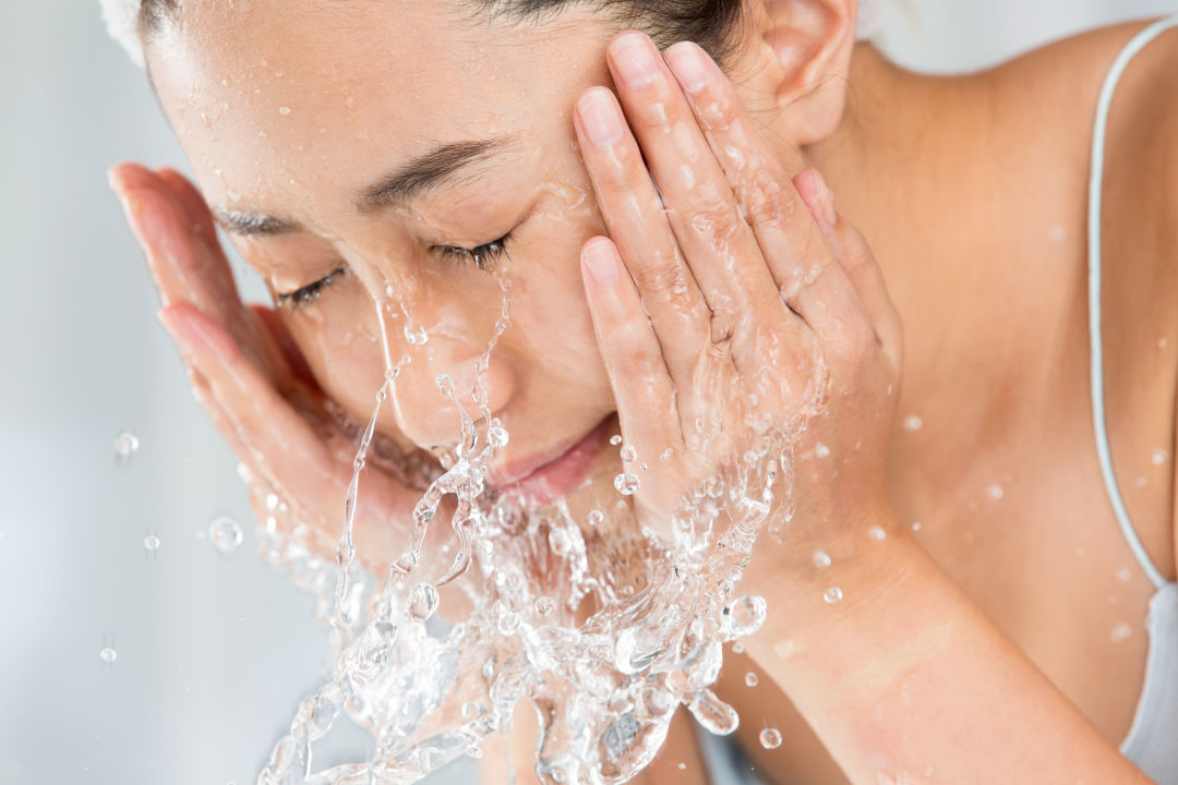 Woman washing face