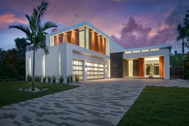 Exterior of a modern white Sarasota home built by Nautilus Homes.