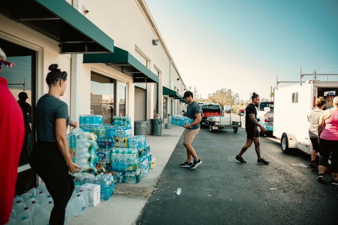 Volunteers unload needed supplies for people affected by Hurricane Ian in North Port.